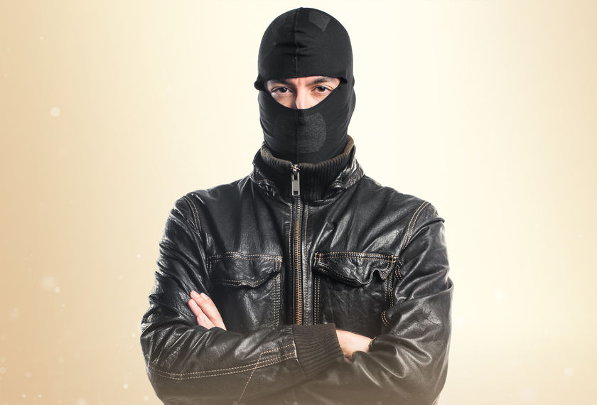 robber with his arms crossed